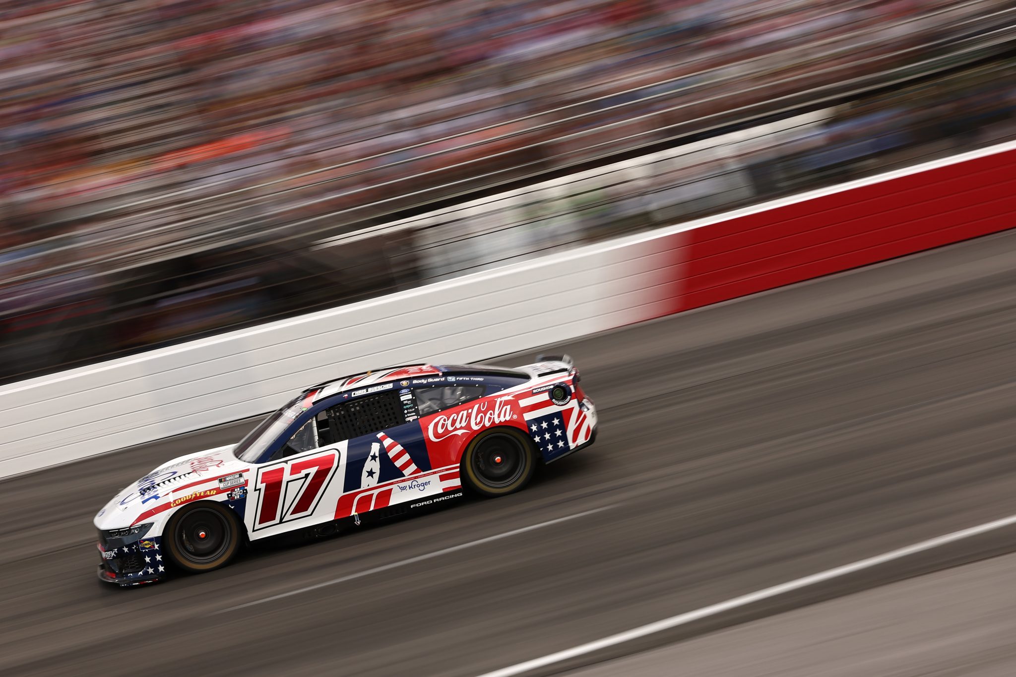 NORTH WILKESBORO, NORTH CAROLINA - JULY 19: Chris Buescher, driver of the #17 Kroger/Coca-Cola Ford, races during the NASCAR Cup Series Window World 450 at North Wilkesboro Speedway on July 19, 2026 in North Wilkesboro, North Carolina. (Photo by Meg Oliphant/Getty Images) | Getty Images