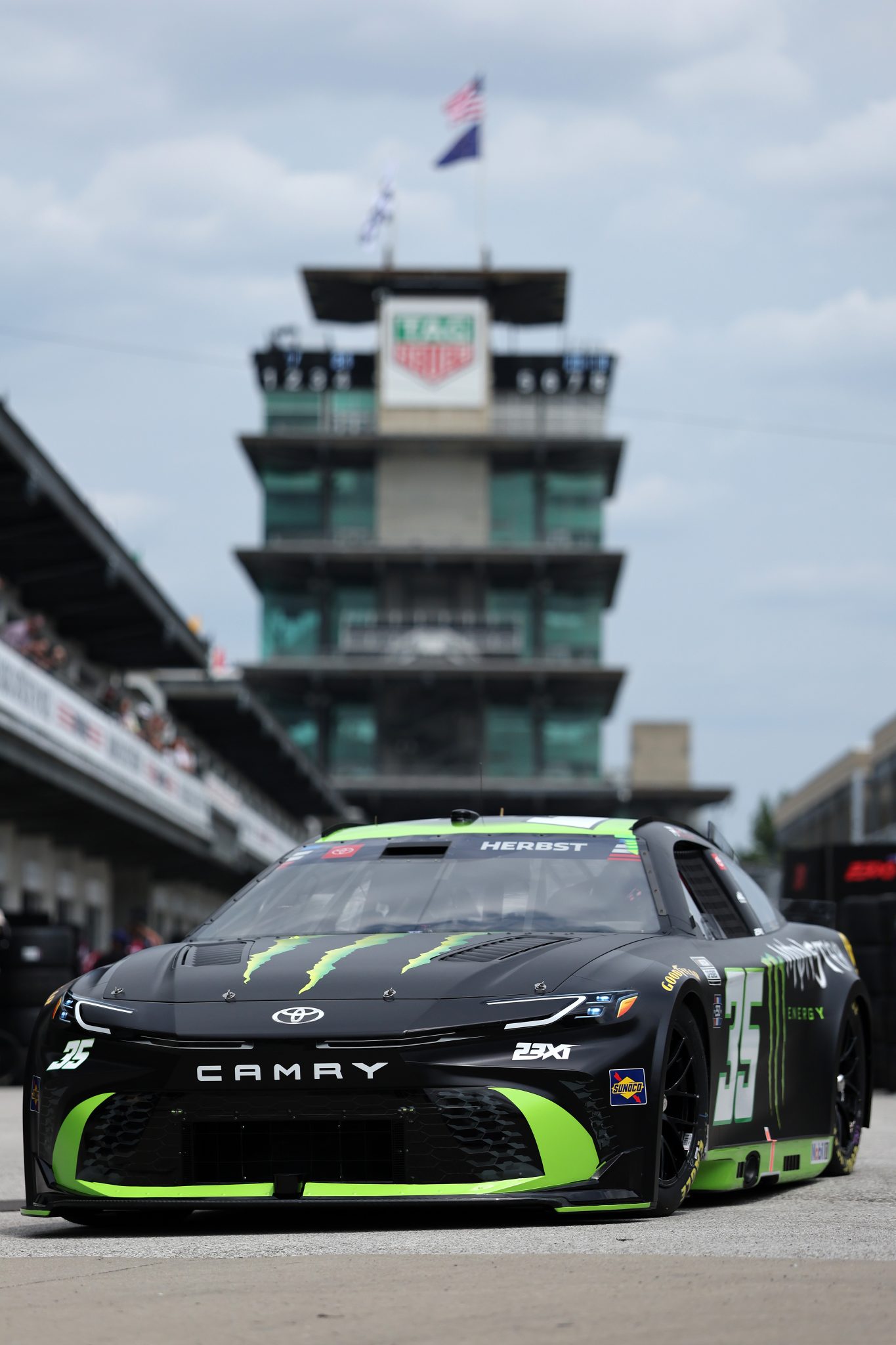 INDIANAPOLIS, INDIANA - JULY 24: Riley Herbst, driver of the #35 Monster Energy Toyota, drives through the garage area during practice for the NASCAR Cup Series Brickyard 400 at Indianapolis Motor Speedway on July 24, 2026 in Indianapolis, Indiana. (Photo by Logan Riely/Getty Images)