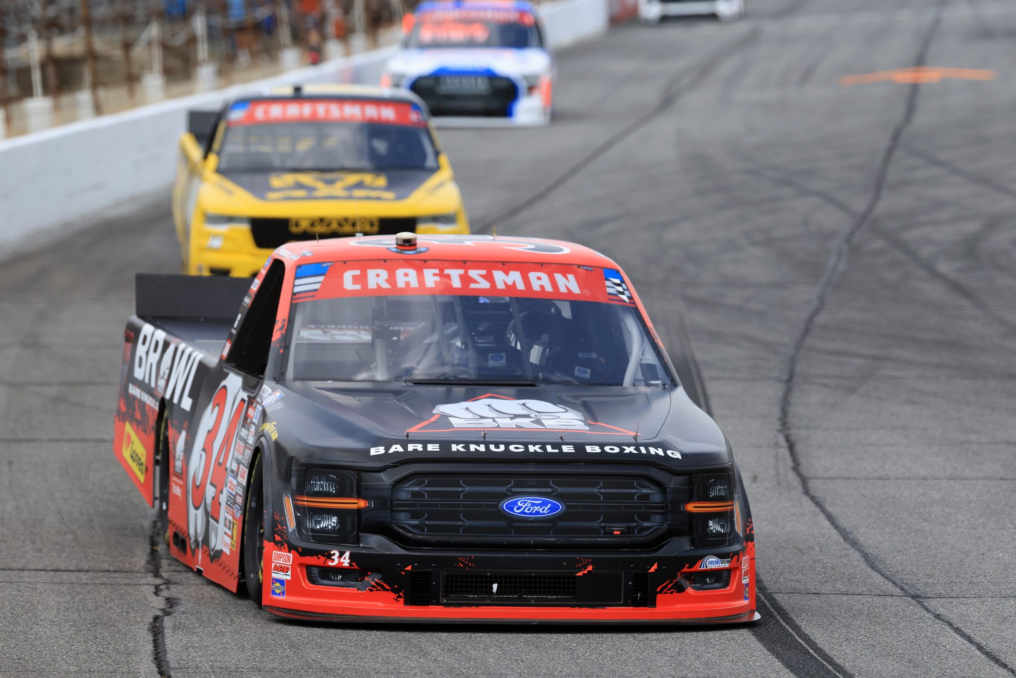INDIANAPOLIS, INDIANA - JULY 24: Layne Riggs, driver of the #34 BKB Bare Knuckle Boxing Ford, drives during practice for the NASCAR Craftsman Truck Series TSport 200 at Lucas Oil Indianapolis Raceway Park on July 24, 2026 in Indianapolis, Indiana. (Photo by Justin Casterline/Getty Images) | Getty Images
