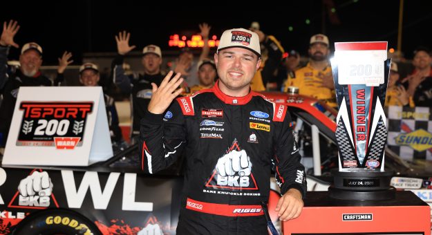 INDIANAPOLIS, INDIANA - JULY 24: Layne Riggs, driver of the #34 BKB Bare Knuckle Boxing Ford, celebrates in victory lane after winning the NASCAR Craftsman Truck Series TSport 200 at Lucas Oil Indianapolis Raceway Park on July 24, 2026 in Indianapolis, Indiana. (Photo by Justin Casterline/Getty Images) | Getty Images