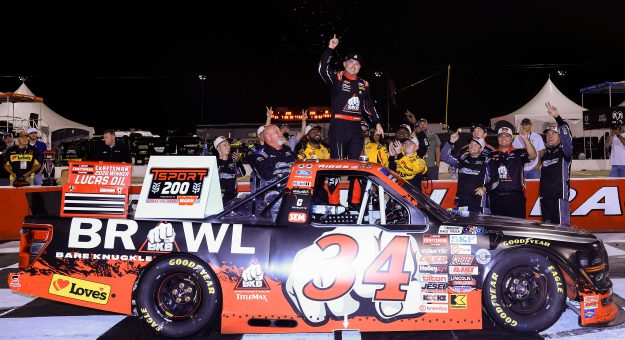 INDIANAPOLIS, INDIANA - JULY 24: Layne Riggs, driver of the #34 BKB Bare Knuckle Boxing Ford, celebrates in victory lane after winning the NASCAR Craftsman Truck Series TSport 200 at Lucas Oil Indianapolis Raceway Park on July 24, 2026 in Indianapolis, Indiana. (Photo by Justin Casterline/Getty Images) | Getty Images