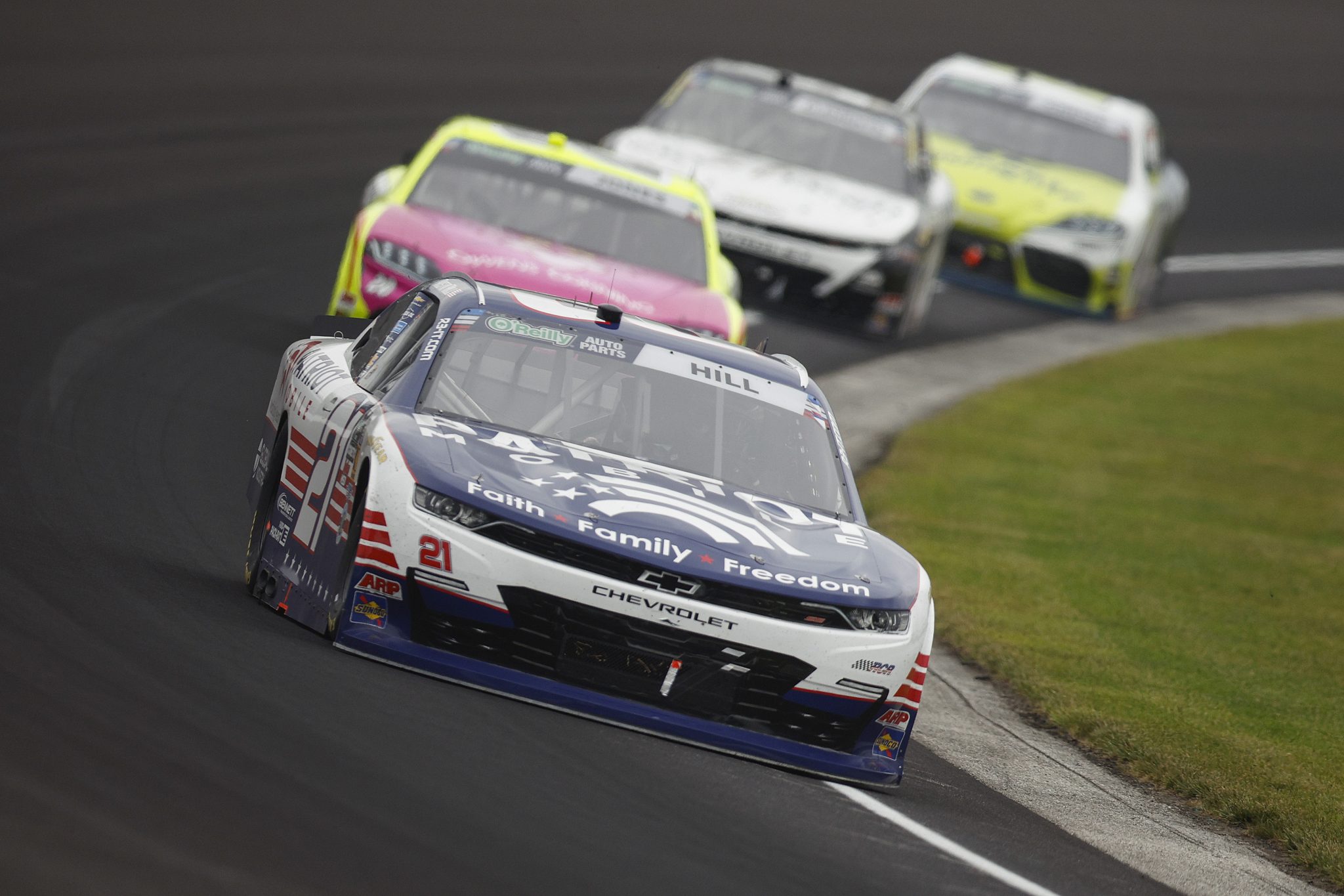 INDIANAPOLIS, INDIANA - JULY 25: Austin Hill, driver of the #21 Patriot Mobile Chevrolet, drives during the NASCAR O'Reilly Auto Parts Series Pennzoil 250 Presented by Take 5 Oil Change at Indianapolis Motor Speedway on July 25, 2026 in Indianapolis, Indiana. (Photo by Sean Gardner/Getty Images) | Getty Images