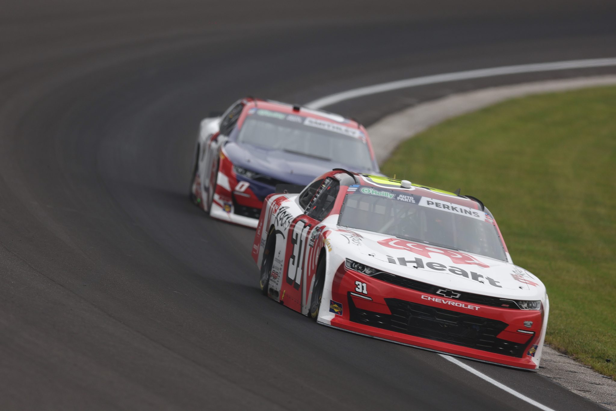 INDIANAPOLIS, INDIANA - JULY 25: Blaine Perkins, driver of the #31 iHeart Q95 Rocks Chevrolet, drives during the NASCAR O'Reilly Auto Parts Series Pennzoil 250 Presented by Take 5 Oil Change at Indianapolis Motor Speedway on July 25, 2026 in Indianapolis, Indiana. (Photo by Logan Riely/Getty Images) | Getty Images