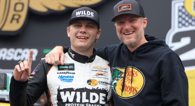INDIANAPOLIS, INDIANA - JULY 25: Carson Kvapil, driver of the #1 Wilde Protein Crackers Chevrolet, celebrates with NASCAR Hall of Famer and JR Motorsports team owner, Dale Earnhardt Jr. in victory lane after winning the NASCAR O'Reilly Auto Parts Series Pennzoil 250 Presented by Take 5 Oil Change at Indianapolis Motor Speedway on July 25, 2026 in Indianapolis, Indiana. (Photo by Justin Casterline/Getty Images) | Getty Images