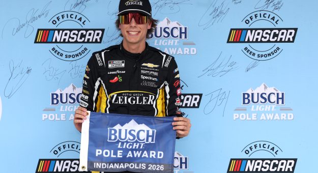 INDIANAPOLIS, INDIANA - JULY 25: Carson Hocevar, driver of the #77 Zeigler Auto Group Chevrolet, poses for photos after winning the pole award during qualifying for the NASCAR Cup Series Brickyard 400 at Indianapolis Motor Speedway on July 25, 2026 in Indianapolis, Indiana. (Photo by Logan Riely/Getty Images) | Getty Images