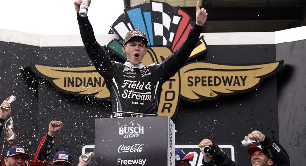INDIANAPOLIS, INDIANA - JULY 26: Corey Heim, driver of the #67 Field & Stream Toyota, celebrates in victory lane after winning the NASCAR Cup Series Brickyard 400 at Indianapolis Motor Speedway on July 26, 2026 in Indianapolis, Indiana. (Photo by Sean Gardner/Getty Images) | Getty Images