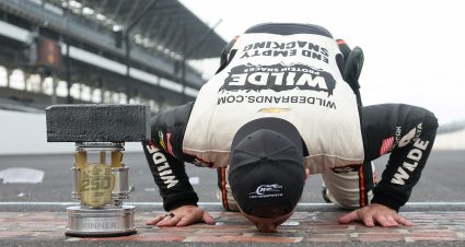 INDIANAPOLIS, INDIANA - JULY 25: Carson Kvapil, driver of the #1 Wilde Protein Crackers Chevrolet, kisses the yard of bricks after winning the NASCAR O'Reilly Auto Parts Series Pennzoil 250 Presented by Take 5 Oil Change at Indianapolis Motor Speedway on July 25, 2026 in Indianapolis, Indiana. (Photo by Logan Riely/Getty Images) | Getty Images