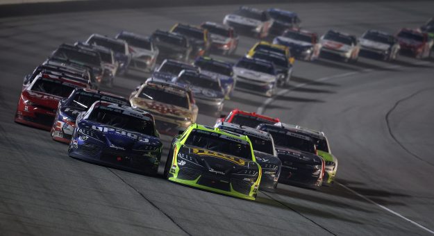 JOLIET, ILLINOIS - JULY 04: Brandon Jones, driver of the #20 Menards/MD Building Products Toyota, and Taylor Gray, driver of the #54 Operation 300 Toyota, lead the field during the NASCAR O'Reilly Auto Parts Series Cuervo 300 at Chicagoland Speedway on July 04, 2026 in Joliet, Illinois. (Photo by James Gilbert/Getty Images) | Getty Images