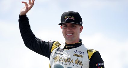 LONG POND, PENNSYLVANIA - JUNE 21: Carson Ware, driver of the #35 Costa Oil Ford, waves to fans as he walks onstage during driver intros prior to the NASCAR Xfinity Series Explore the Pocono Mountains 250 at Pocono Raceway on June 21, 2025 in Long Pond, Pennsylvania. (Photo by Jonathan Bachman/Getty Images) | Getty Images