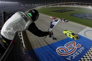 JOLIET, ILLINOIS - JULY 04: Brandon Jones, driver of the #20 Menards/MD Building Products Toyota, takes the checkered flag to win the NASCAR O'Reilly Auto Parts Series Cuervo 300 at Chicagoland Speedway on July 04, 2026 in Joliet, Illinois. (Photo by James Gilbert/Getty Images) | Getty Images