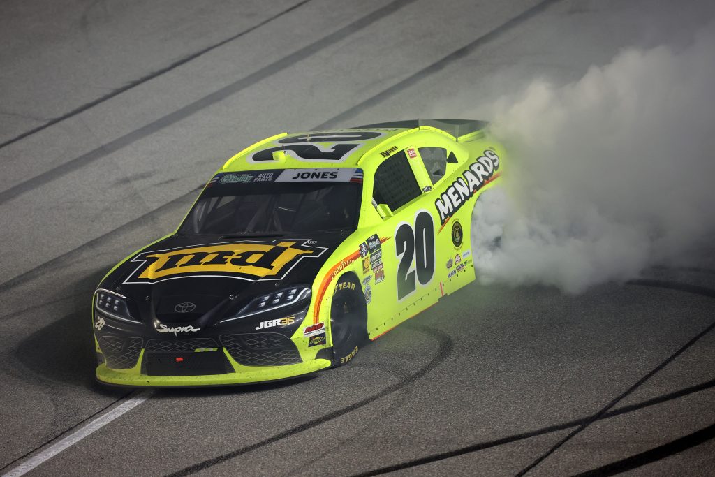 JOLIET, ILLINOIS - JULY 04: Brandon Jones, driver of the #20 Menards/MD Building Products Toyota, celebrates with a burnout after winning the NASCAR O'Reilly Auto Parts Series Cuervo 300 at Chicagoland Speedway on July 04, 2026 in Joliet, Illinois. (Photo by James Gilbert/Getty Images) | Getty Images
