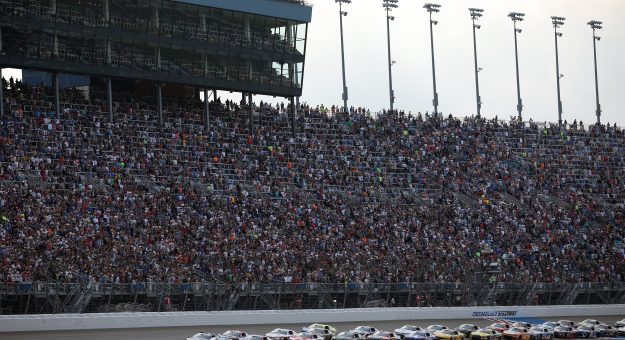 JOLIET, ILLINOIS - JULY 05: Denny Hamlin, driver of the #11 Progressive Insurance Toyota, and Kyle Larson, driver of the #5 HendrickCars.com Chevrolet, lead the field to start the NASCAR Cup Series eero 400 at Chicagoland Speedway on July 05, 2026 in Joliet, Illinois. (Photo by James Gilbert/Getty Images) | Getty Images
