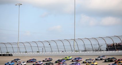 JOLIET, ILLINOIS - JULY 05: Denny Hamlin, driver of the #11 Progressive Insurance Toyota, and Kyle Larson, driver of the #5 HendrickCars.com Chevrolet, lead the field to start the NASCAR Cup Series eero 400 at Chicagoland Speedway on July 05, 2026 in Joliet, Illinois. (Photo by James Gilbert/Getty Images) | Getty Images