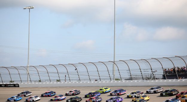 JOLIET, ILLINOIS - JULY 05: Denny Hamlin, driver of the #11 Progressive Insurance Toyota, and Kyle Larson, driver of the #5 HendrickCars.com Chevrolet, lead the field to start the NASCAR Cup Series eero 400 at Chicagoland Speedway on July 05, 2026 in Joliet, Illinois. (Photo by James Gilbert/Getty Images) | Getty Images