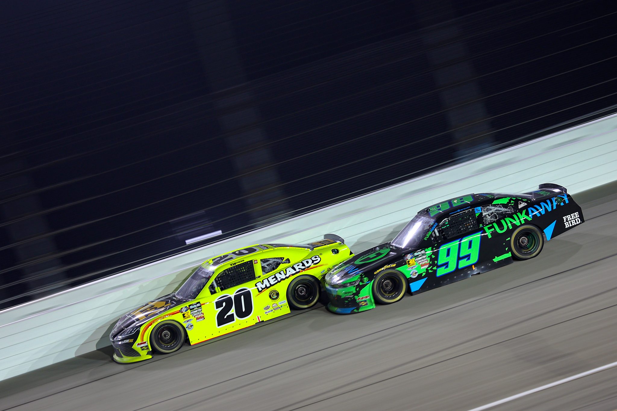 JOLIET, ILLINOIS - JULY 04: Brandon Jones, driver of the #20 Menards/MD Building Products Toyota, and Parker Retzlaff, driver of the #99 FUNKAWAY Chevrolet, race during the NASCAR O'Reilly Auto Parts Series Cuervo 300 at Chicagoland Speedway on July 04, 2026 in Joliet, Illinois. (Photo by Jonathan Bachman/Getty Images) | Getty Images