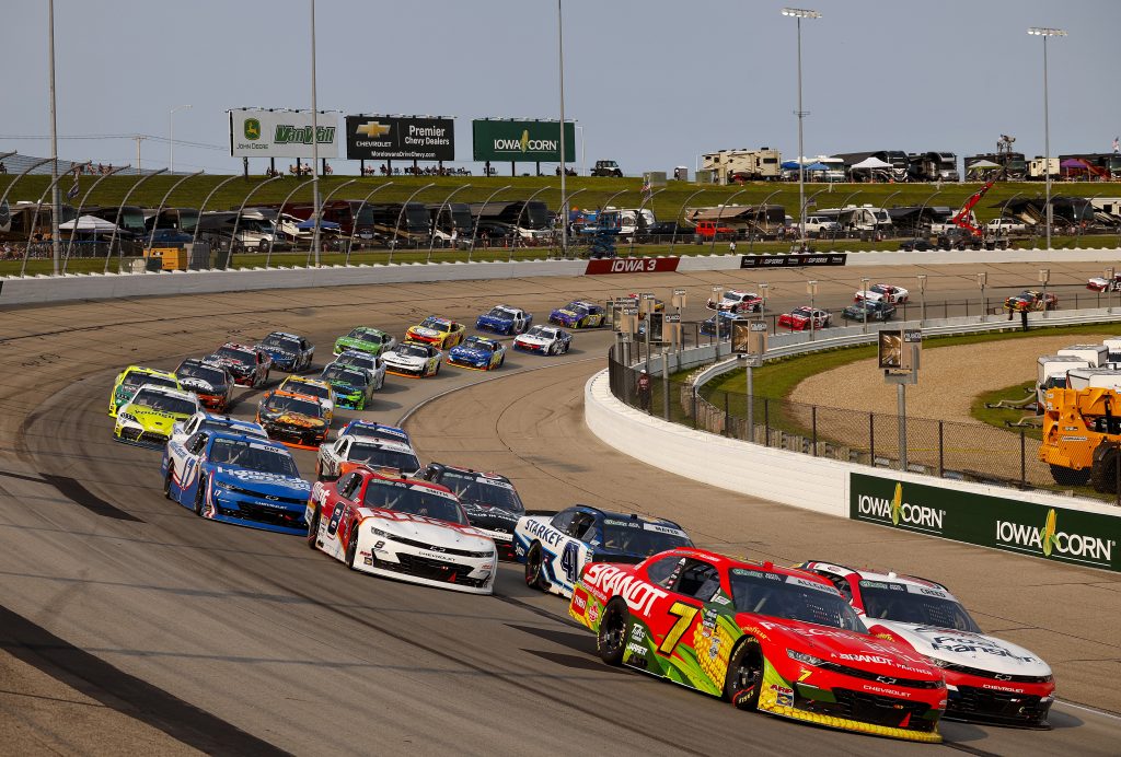 NEWTON, IOWA - AUGUST 08: Justin Allgaier, driver of the #7 Precision Build/BRANDT Chevrolet, and Sheldon Creed, driver of the #00 Road Ranger Chevrolet, lead the field during the NASCAR O'Reilly Auto Parts Series HyVee Perks 250 at Iowa Speedway on August 08, 2026 in Newton, Iowa. (Photo by Sean Gardner/Getty Images) | Getty Images