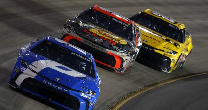 LEBANON, TENNESSEE - MAY 31: Denny Hamlin, driver of the #11 Progressive Insurance Toyota, Chase Briscoe, driver of the #19 Bass Pro Shops Toyota, and Christopher Bell, driver of the #20 DeWalt Toyota, race during the NASCAR Cup Series Cracker Barrel 400 at Nashville Superspeedway on May 31, 2026 in Lebanon, Tennessee. (Photo by Sean Gardner/Getty Images) | Getty Images