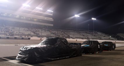RICHMOND, VIRGINIA - AUGUST 14: A general view of trucks covered on the grid under a weather delay of the NASCAR Craftsman Truck Series Black's Tire 250 presented by BTS Rewards at Richmond Raceway on August 14, 2026 in Richmond, Virginia. (Photo by David Jensen/Getty Images) | Getty Images