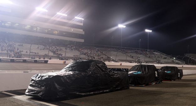 RICHMOND, VIRGINIA - AUGUST 14: A general view of trucks covered on the grid under a weather delay of the NASCAR Craftsman Truck Series Black's Tire 250 presented by BTS Rewards at Richmond Raceway on August 14, 2026 in Richmond, Virginia. (Photo by David Jensen/Getty Images) | Getty Images