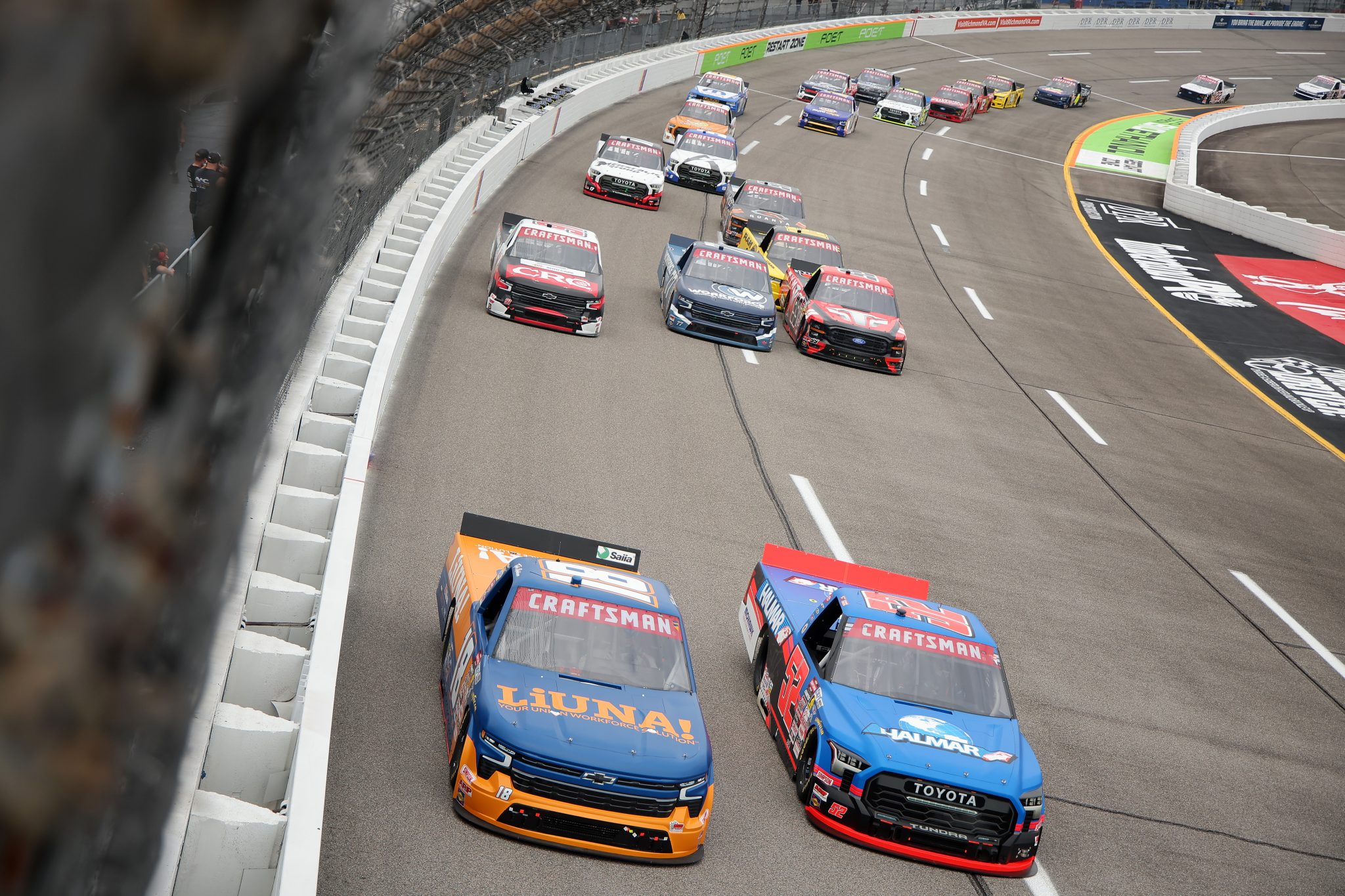 RICHMOND, VIRGINIA - AUGUST 15: Tyler Ankrum, driver of the #18 LIUNA Chevrolet, and Stewart Friesen, driver of the #52 Halmar International Toyota, race during the NASCAR Craftsman Truck Series Black's Tire 250 presented by BTS Rewards at Richmond Raceway on August 15, 2026 in Richmond, Virginia. (Photo by Jonathan Bachman/Getty Images) | Getty Images