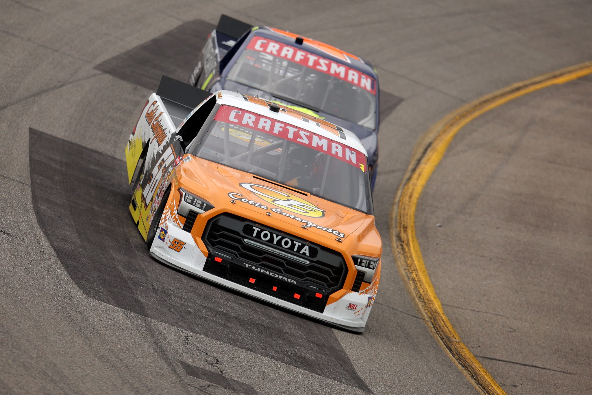 RICHMOND, VIRGINIA - AUGUST 15: Timmy Hill, driver of the #56 Coble Enterprises Toyota, and Connor Hall, driver of the #4 TowneBank/Breeden Concrete Chevrolet, race during the NASCAR Craftsman Truck Series Black's Tire 250 presented by BTS Rewards at Richmond Raceway on August 15, 2026 in Richmond, Virginia. (Photo by Jonathan Bachman/Getty Images) | Getty Images