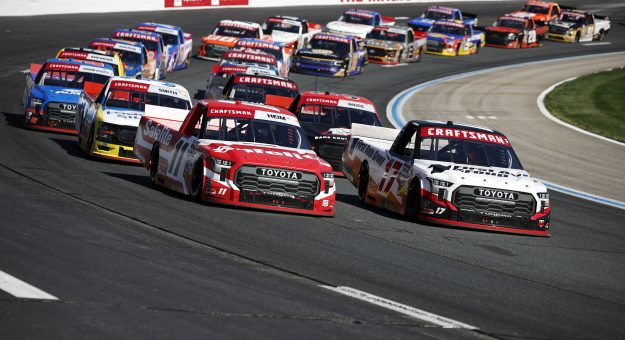LOUDON, NEW HAMPSHIRE - SEPTEMBER 20: Corey Heim, driver of the #11 Safelite Toyota, and Giovanni Ruggiero, driver of the #17 First Auto Group Toyota, race during the NASCAR Craftsman Truck Series Team EJP 175 at New Hampshire Motor Speedway on September 20, 2025 in Loudon, New Hampshire. (Photo by Sean Gardner/Getty Images) | Getty Images