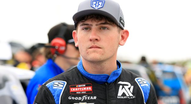 INDIANAPOLIS, INDIANA - JULY 24: Dawson Sutton, driver of the #26 Rackley Roofing Chevrolet, looks on during qualifying for the NASCAR Craftsman Truck Series TSport 200 at Lucas Oil Indianapolis Raceway Park on July 24, 2026 in Indianapolis, Indiana. (Photo by Justin Casterline/Getty Images) | Getty Images