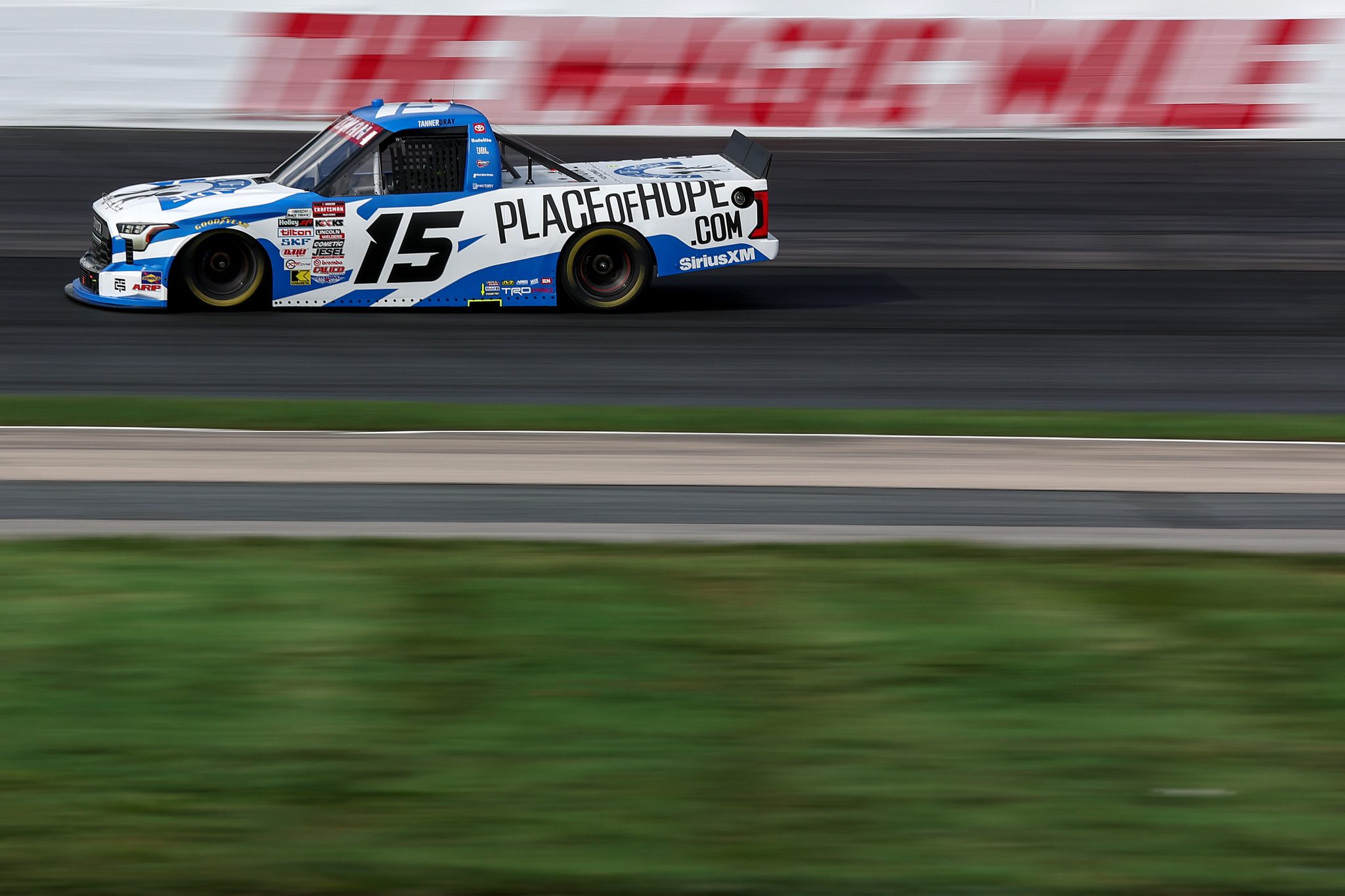 LOUDON, NEW HAMPSHIRE - AUGUST 21: Tanner Gray, driver of the #15 Place of Hope Toyota, drives during practice for the NASCAR Craftsman Truck Series Team EJP 175 at New Hampshire Motor Speedway on August 21, 2026 in Loudon, New Hampshire. (Photo by Meg Oliphant/Getty Images) | Getty Images