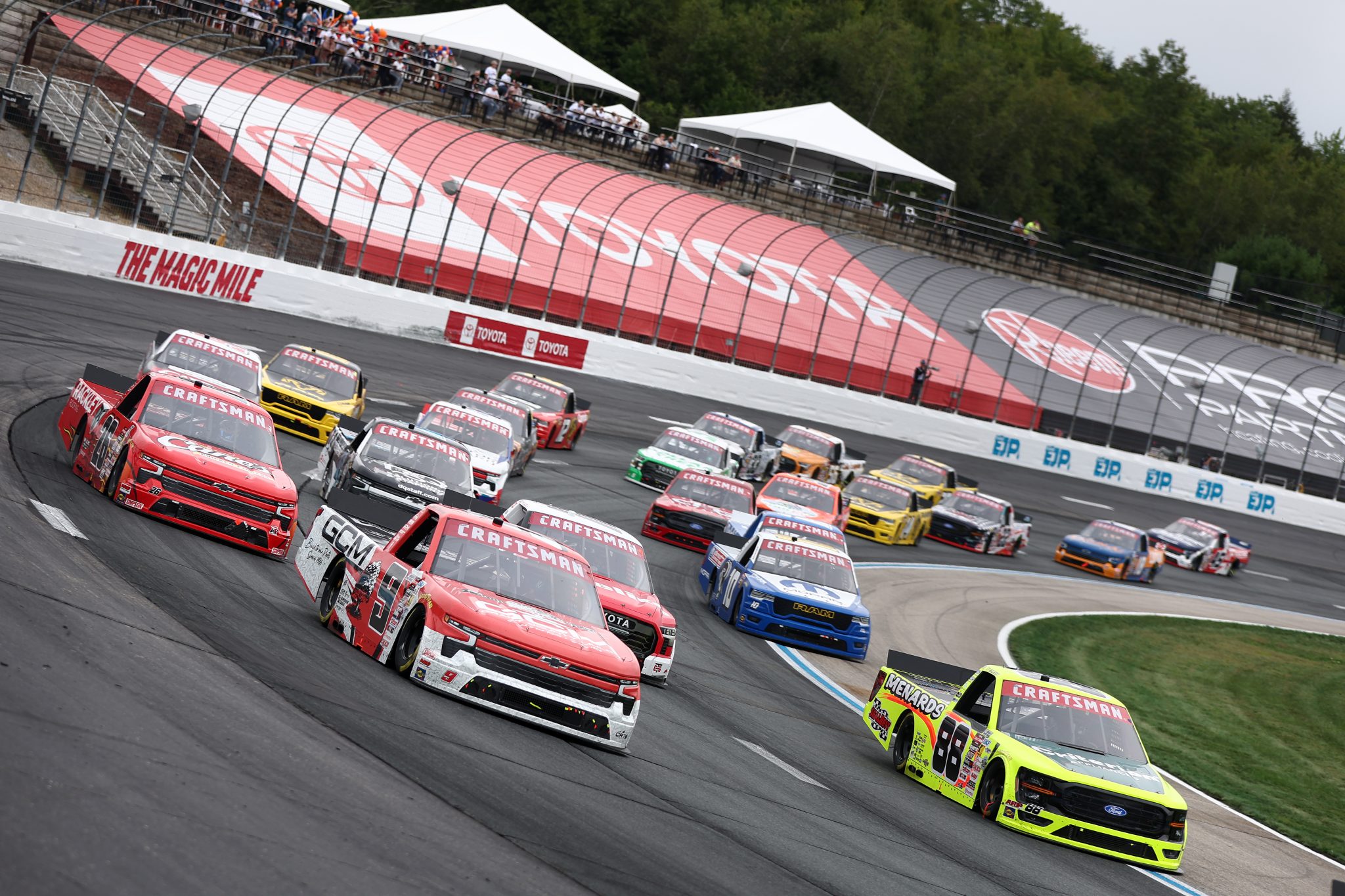 LOUDON, NEW HAMPSHIRE - AUGUST 22: Grant Enfinger, driver of the #9 Grant County Mulch Chevrolet, and Ty Majeski, driver of the #88 Criterion/Menards Ford, race during the NASCAR Craftsman Truck Series Team EJP 175 at New Hampshire Motor Speedway on August 22, 2026 in Loudon, New Hampshire. (Photo by Meg Oliphant/Getty Images) | Getty Images