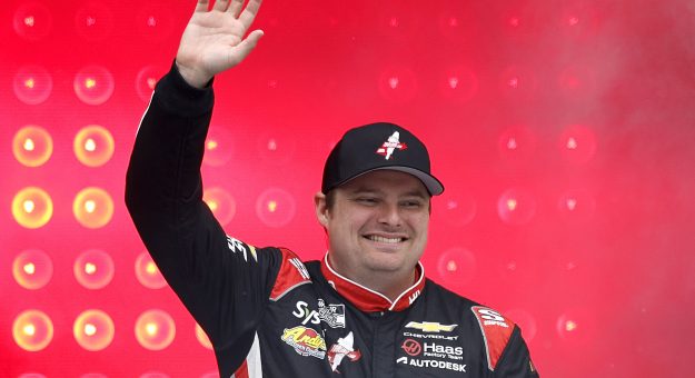 LOUDON, NEW HAMPSHIRE - AUGUST 23: Cole Custer, driver of the #41 HaasTooling.com Chevrolet, waves to fans as he walks onstage during driver intros prior to the NASCAR Cup Series Dollar Tree 301 at New Hampshire Motor Speedway on August 23, 2026 in Loudon, New Hampshire. (Photo by Sean Gardner/Getty Images) | Getty Images