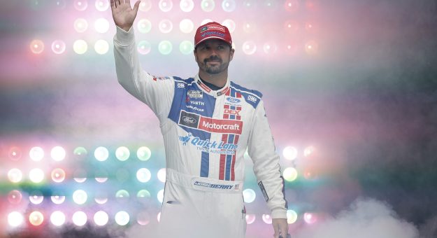 LOUDON, NEW HAMPSHIRE - AUGUST 23: Josh Berry, driver of the #21 Motorcraft/Quick Lane Ford, waves to fans as he walks onstage during driver intros prior to the NASCAR Cup Series Dollar Tree 301 at New Hampshire Motor Speedway on August 23, 2026 in Loudon, New Hampshire. (Photo by Sean Gardner/Getty Images) | Getty Images