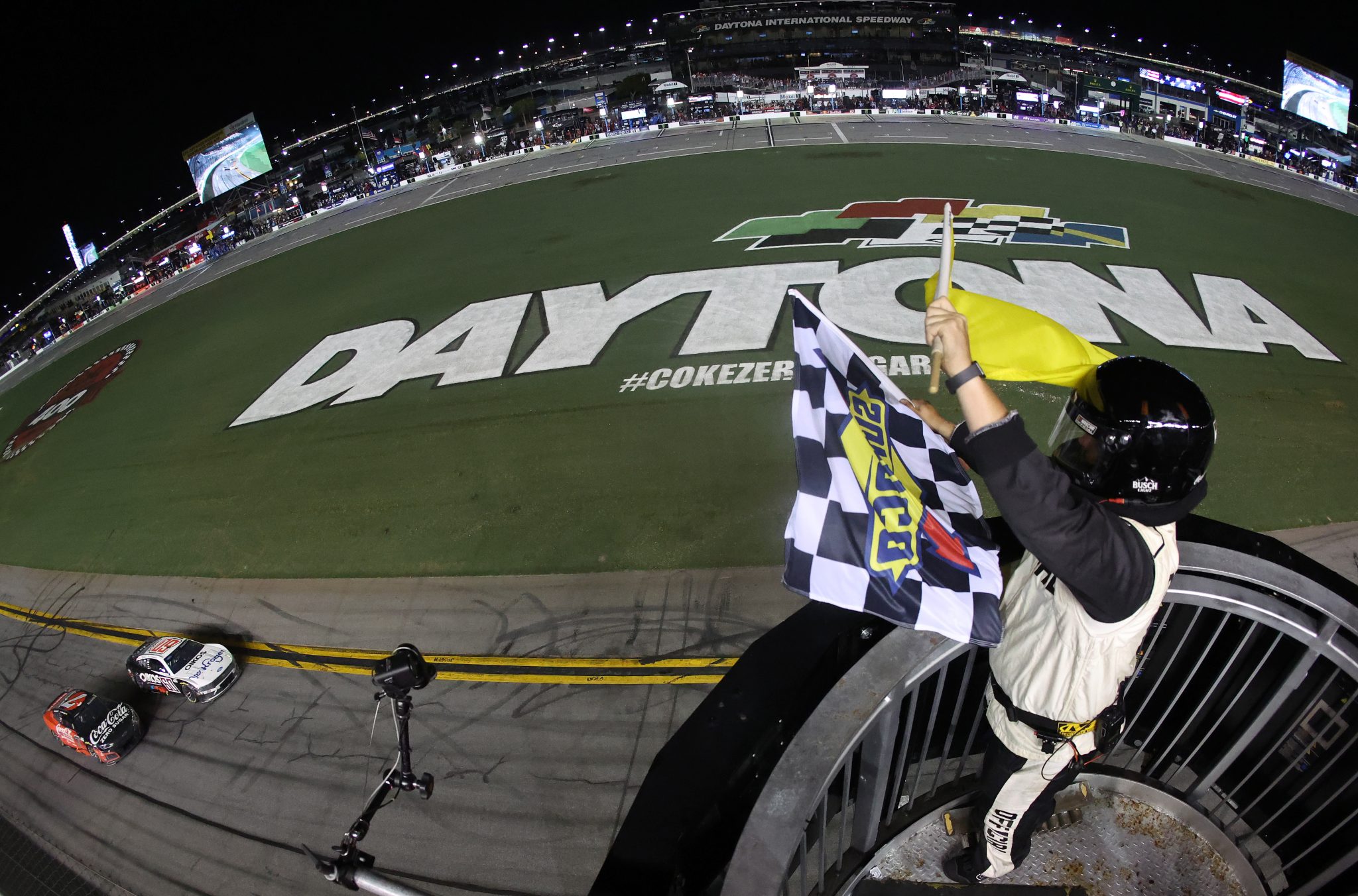 DAYTONA BEACH, FLORIDA - AUGUST 29: Ryan Preece, driver of the #60 Kroger/OIKOS Ford, takes the checkered flag under caution ahead of Daniel Suarez, driver of the #7 Coke Zero Sugar Chevrolet, to win the NASCAR Cup Series Coke Zero Sugar 400 at Daytona International Speedway on August 29, 2026 in Daytona Beach, Florida. (Photo by James Gilbert/Getty Images) | Getty Images