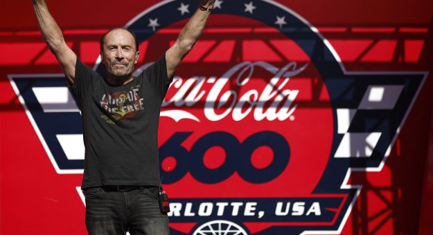 CONCORD, NORTH CAROLINA - MAY 29: Lee Greenwood performs onstage during pre-race ceremonies prior to the NASCAR Cup Series Coca-Cola 600 at Charlotte Motor Speedway on May 29, 2022 in Concord, North Carolina. (Photo by Jared C. Tilton/Getty Images) | Getty Images