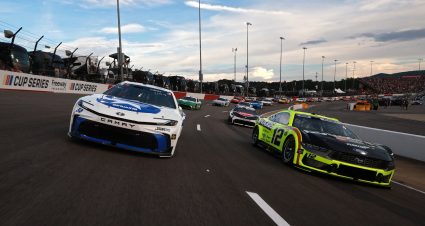 NORTH WILKESBORO, NORTH CAROLINA - JULY 19: Ty Gibbs, driver of the #54 SiriusXM Toyota, and Ryan Blaney, driver of the #12 Menards/Duracell Ford, lead the field during a caution lap during the NASCAR Cup Series Window World 450 at North Wilkesboro Speedway on July 19, 2026 in North Wilkesboro, North Carolina. (Photo by Meg Oliphant/Getty Images) | Getty Images