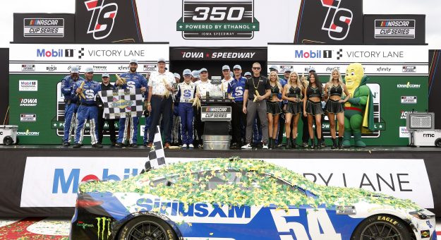 NEWTON, IOWA - AUGUST 09: Ty Gibbs, driver of the #54 SiriusXM Toyota, and crew celebrate in victory lane after winning the NASCAR Cup Series Iowa Corn 350 Powered by Ethanol at Iowa Speedway on August 09, 2026 in Newton, Iowa. (Photo by Sean Gardner/Getty Images) | Getty Images
