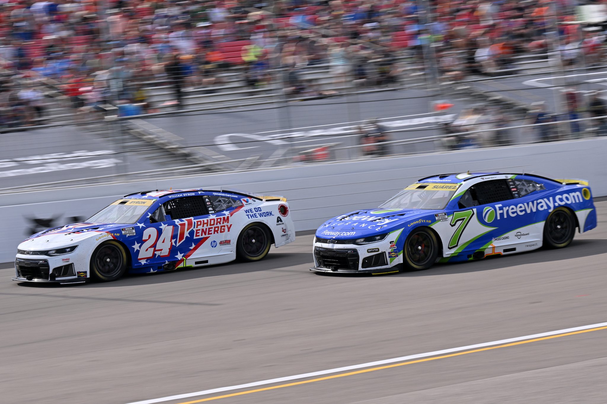 MADISON, ILLINOIS - SEPTEMBER 13: William Byron, driver of the #24 Phorm Energy Chevrolet, and Daniel Suarez, driver of the #7 Freeway Insurance Chevrolet, race during the NASCAR Cup Series Enjoy Illinois 300 at WWT Raceway on September 13, 2026 in Madison, Illinois. (Photo by Amy Kontras/Getty Images) | Getty Images