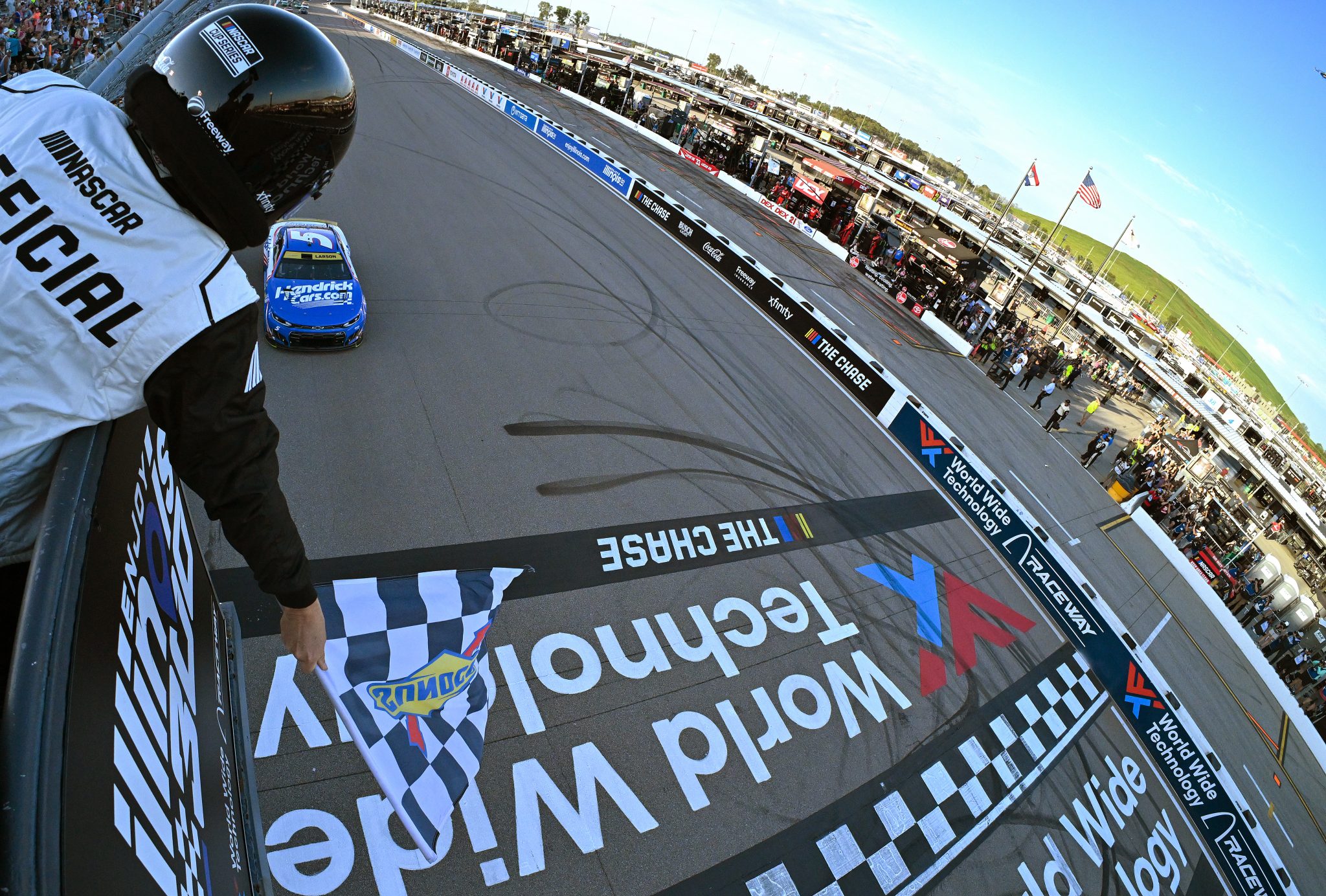 MADISON, ILLINOIS - SEPTEMBER 13: Kyle Larson, driver of the #5 HendrickCars.com Chevrolet, takes the checkered flag to win the NASCAR Cup Series Enjoy Illinois 300 at WWT Raceway on September 13, 2026 in Madison, Illinois. (Photo by Jeff Curry/Getty Images) | Getty Images