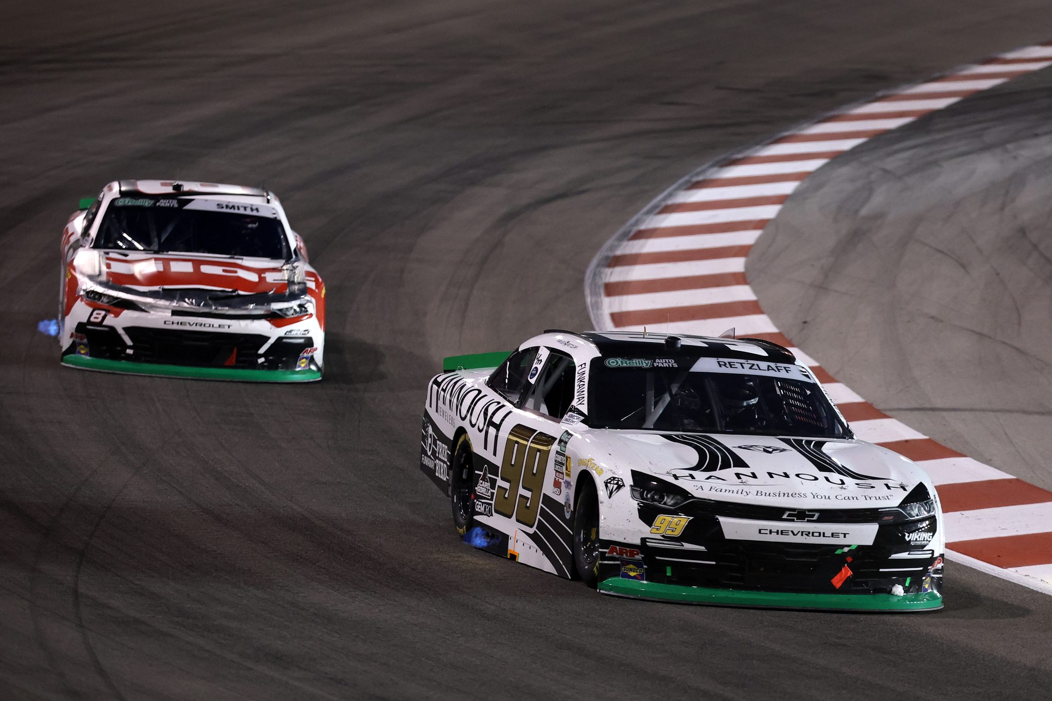 MADISON, ILLINOIS - SEPTEMBER 12: Parker Retzlaff, driver of the #99 Hannoush Jewelers Chevrolet, and Sammy Smith, driver of the #8 Pilot Chevrolet, race during the NASCAR O'Reilly Auto Parts Series Nu Way 225 Powered by Bobcat and Sauced by Blues Hog at WWT Raceway on September 12, 2026 in Madison, Illinois. (Photo by Chris Graythen/Getty Images) | Getty Images
