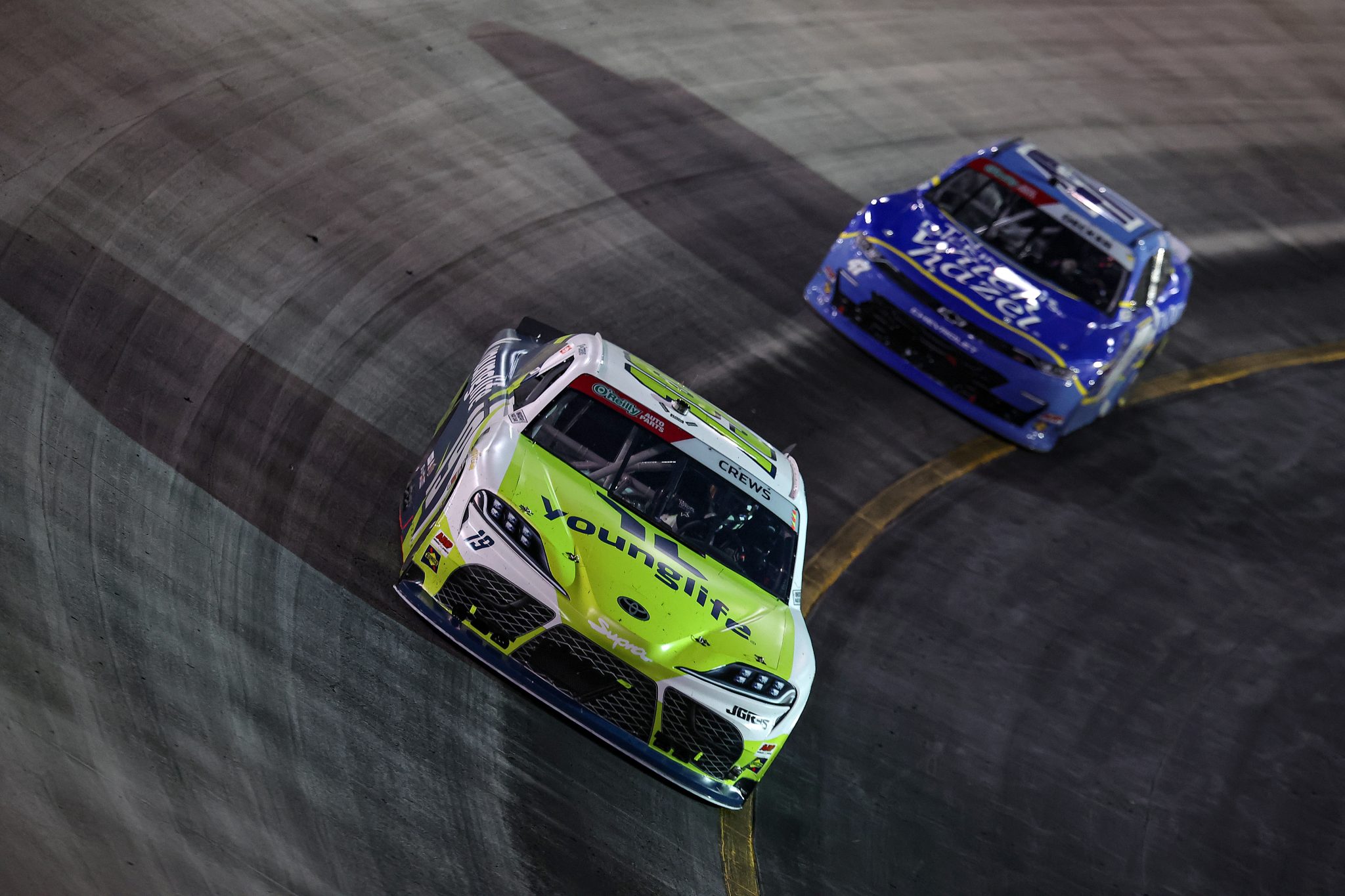 BRISTOL, TENNESSEE - SEPTEMBER 18: Brent Crews, driver of the #19 YoungLife Toyota, and Natalie Decker, driver of the #47 T.N Dickinson's Witch Hazel Chevrolet, race during the NASCAR O'Reilly Auto Parts Series Food City 300 at Bristol Motor Speedway on September 18, 2026 in Bristol, Tennessee. (Photo by Jonathan Bachman/Getty Images) | Getty Images