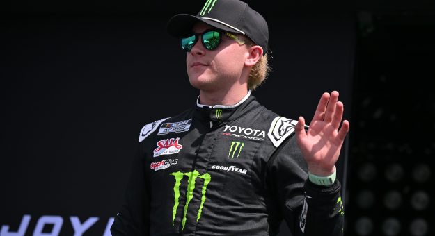 MADISON, ILLINOIS - SEPTEMBER 13: Ty Gibbs, driver of the #54 Monster Energy Toyota, waves to fans as he walks onstage during driver intros prior to the NASCAR Cup Series Enjoy Illinois 300 at WWT Raceway on September 13, 2026 in Madison, Illinois. (Photo by Amy Kontras/Getty Images) | Getty Images