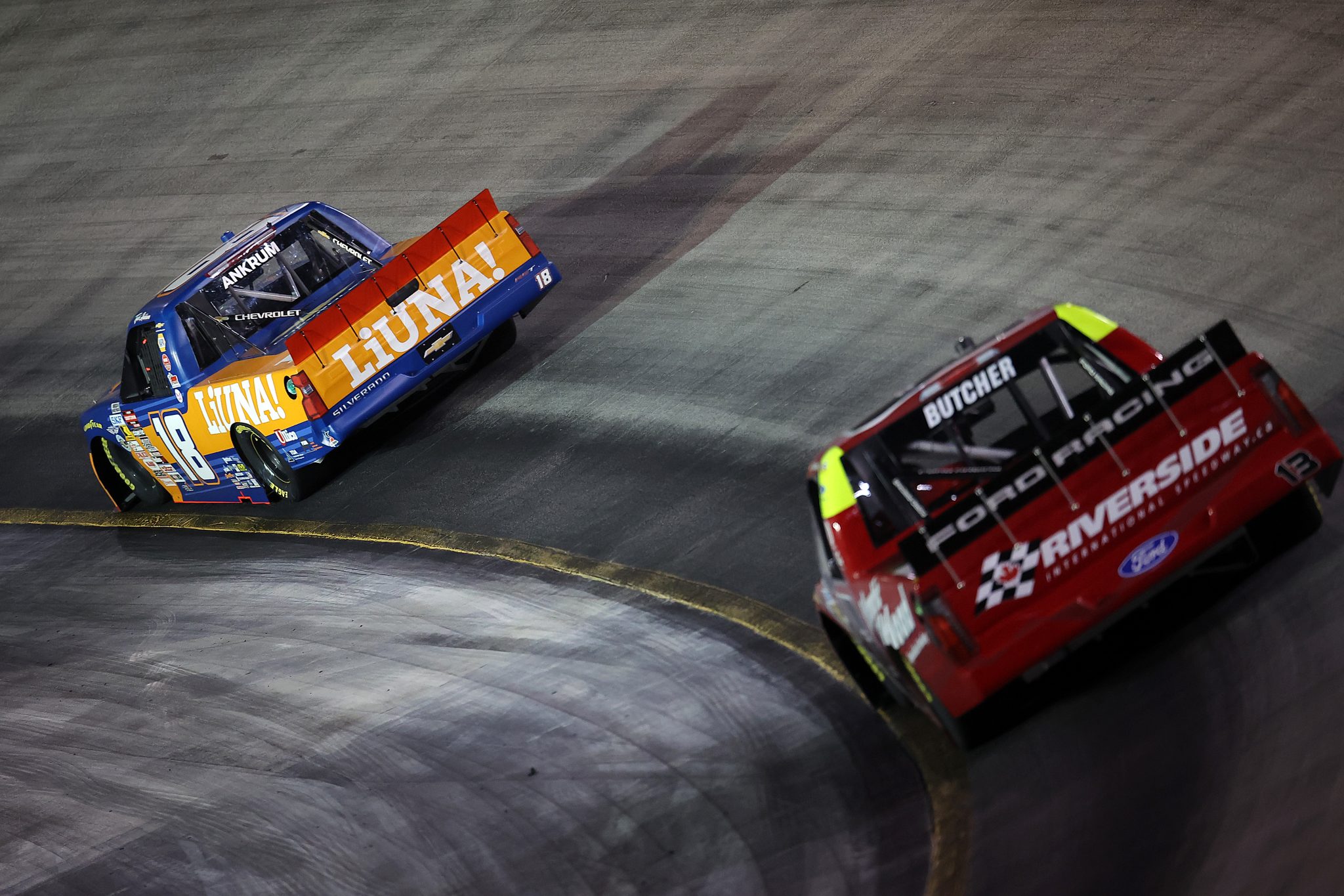 BRISTOL, TENNESSEE - SEPTEMBER 17: Tyler Ankrum, driver of the #18 LIUNA Chevrolet, and Cole Butcher, driver of the #13 Atlantic Tilt Load Ford, race during the NASCAR Craftsman Truck Series UNOH 250 Presented by Ohio Logistics at Bristol Motor Speedway on September 17, 2026 in Bristol, Tennessee. (Photo by Jonathan Bachman/Getty Images) | Getty Images