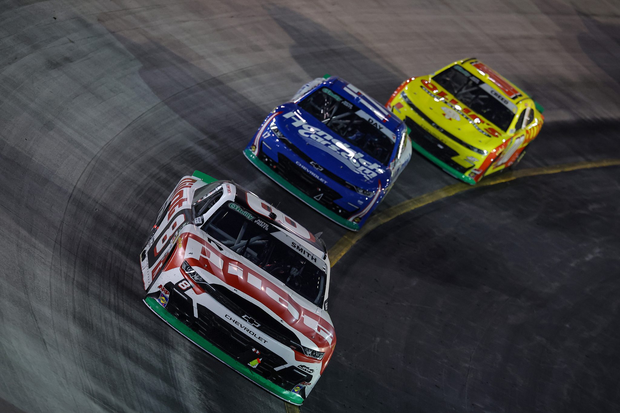 BRISTOL, TENNESSEE - SEPTEMBER 18: Sammy Smith, driver of the #8 Pilot Chevrolet, Corey Day, driver of the #17 HendrickCars.com Chevrolet, and Sheldon Creed, driver of the #00 Ollie's Chevrolet, race during the NASCAR O'Reilly Auto Parts Series Food City 300 at Bristol Motor Speedway on September 18, 2026 in Bristol, Tennessee. (Photo by Jonathan Bachman/Getty Images) | Getty Images