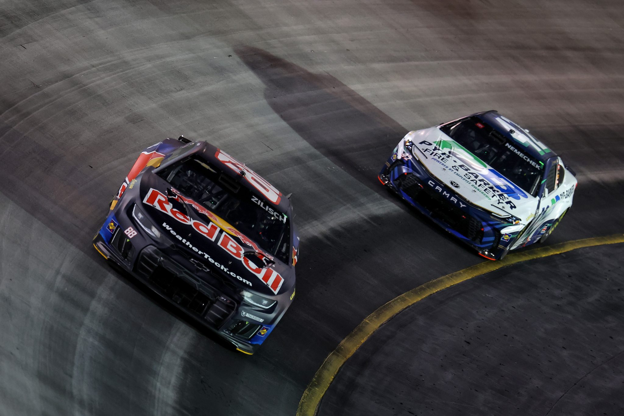 BRISTOL, TENNESSEE - SEPTEMBER 19: Connor Zilisch, driver of the #88 Red Bull Chevrolet, and John Hunter Nemechek, driver of the #42 Pye-Barker Fire & Safety Toyota, race during the NASCAR Cup Series Bass Pro Shops Night Race at Bristol Motor Speedway on September 19, 2026 in Bristol, Tennessee. (Photo by Jonathan Bachman/Getty Images) | Getty Images