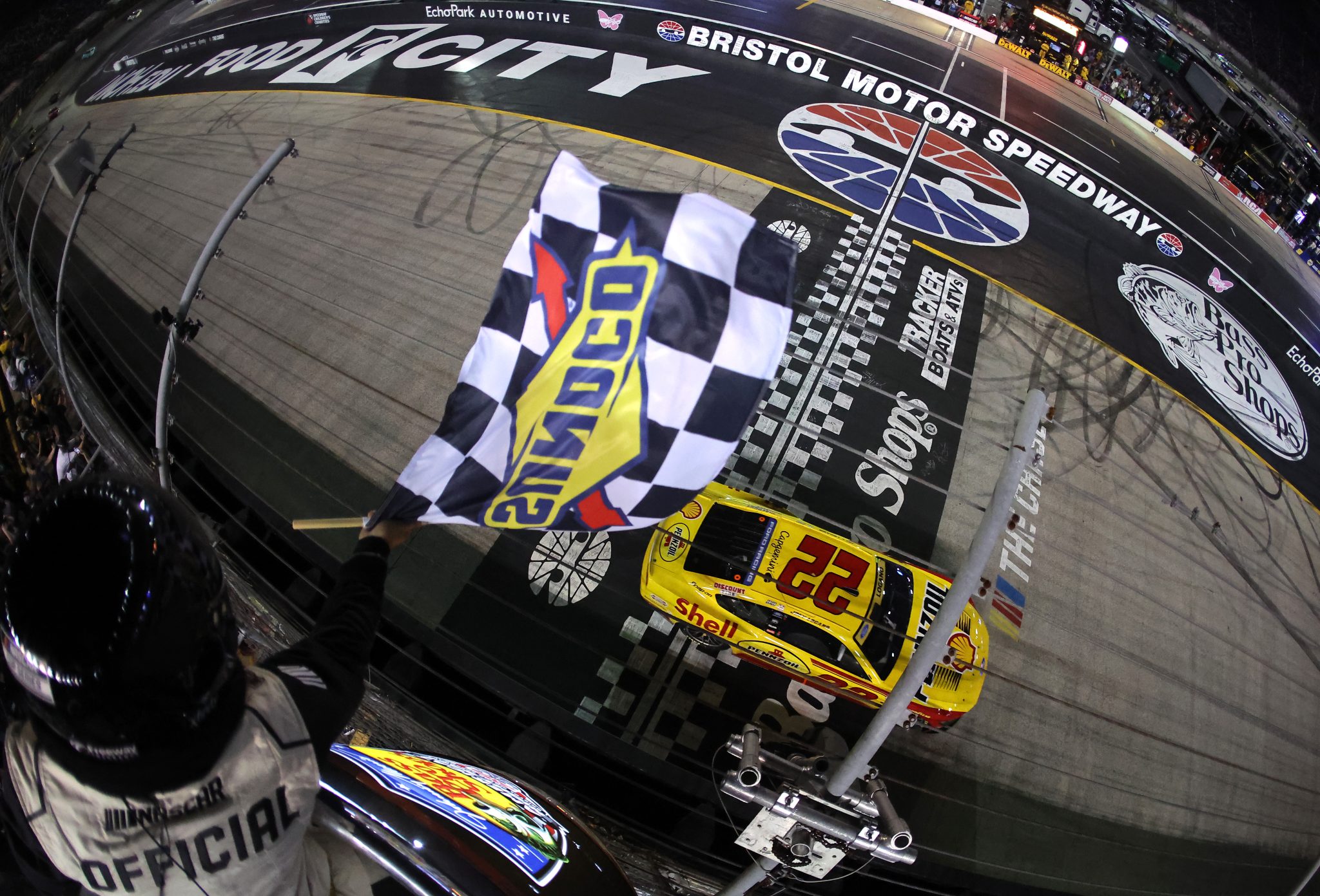 BRISTOL, TENNESSEE - SEPTEMBER 19: Joey Logano, driver of the #22 Shell Pennzoil Ford, takes the checkered flag to win the NASCAR Cup Series Bass Pro Shops Night Race at Bristol Motor Speedway on September 19, 2026 in Bristol, Tennessee. (Photo by Jonathan Bachman/Getty Images) | Getty Images
