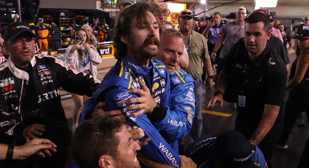 BRISTOL, TENNESSEE - SEPTEMBER 19: Ryan Blaney, driver of the #12 WABASH Ford, is separated from an altercation with Carson Hocevar, driver of the #77 Zeigler Auto Group Chevrolet, (not pictured) after the NASCAR Cup Series Bass Pro Shops Night Race at Bristol Motor Speedway on September 19, 2026 in Bristol, Tennessee. (Photo by Chris Graythen/Getty Images) | Getty Images