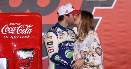 CONCORD, NORTH CAROLINA - MAY 24: Daniel Suarez, driver of the #7 Freeway Insurance Chevrolet, and his wife, Julia Piquet kiss in victory lane after winning the NASCAR Cup Series Coca-Cola 600 at Charlotte Motor Speedway on May 24, 2026 in Concord, North Carolina. (Photo by David Jensen/Getty Images) | Getty Images