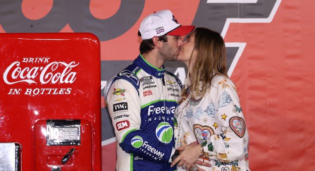 CONCORD, NORTH CAROLINA - MAY 24: Daniel Suarez, driver of the #7 Freeway Insurance Chevrolet, and his wife, Julia Piquet kiss in victory lane after winning the NASCAR Cup Series Coca-Cola 600 at Charlotte Motor Speedway on May 24, 2026 in Concord, North Carolina. (Photo by David Jensen/Getty Images) | Getty Images