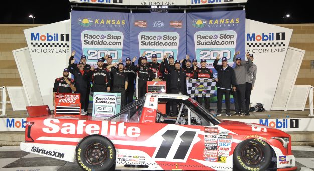 KANSAS CITY, KANSAS - SEPTEMBER 26: Kaden Honeycutt, driver of the #11 Safelite Toyota, and crew celebrate in victory lane after winning the NASCAR Craftsman Truck Series Race to Stop Suicide 200 at Kansas Speedway on September 26, 2026 in Kansas City, Kansas. (Photo by Jonathan Bachman/Getty Images) | Getty Images