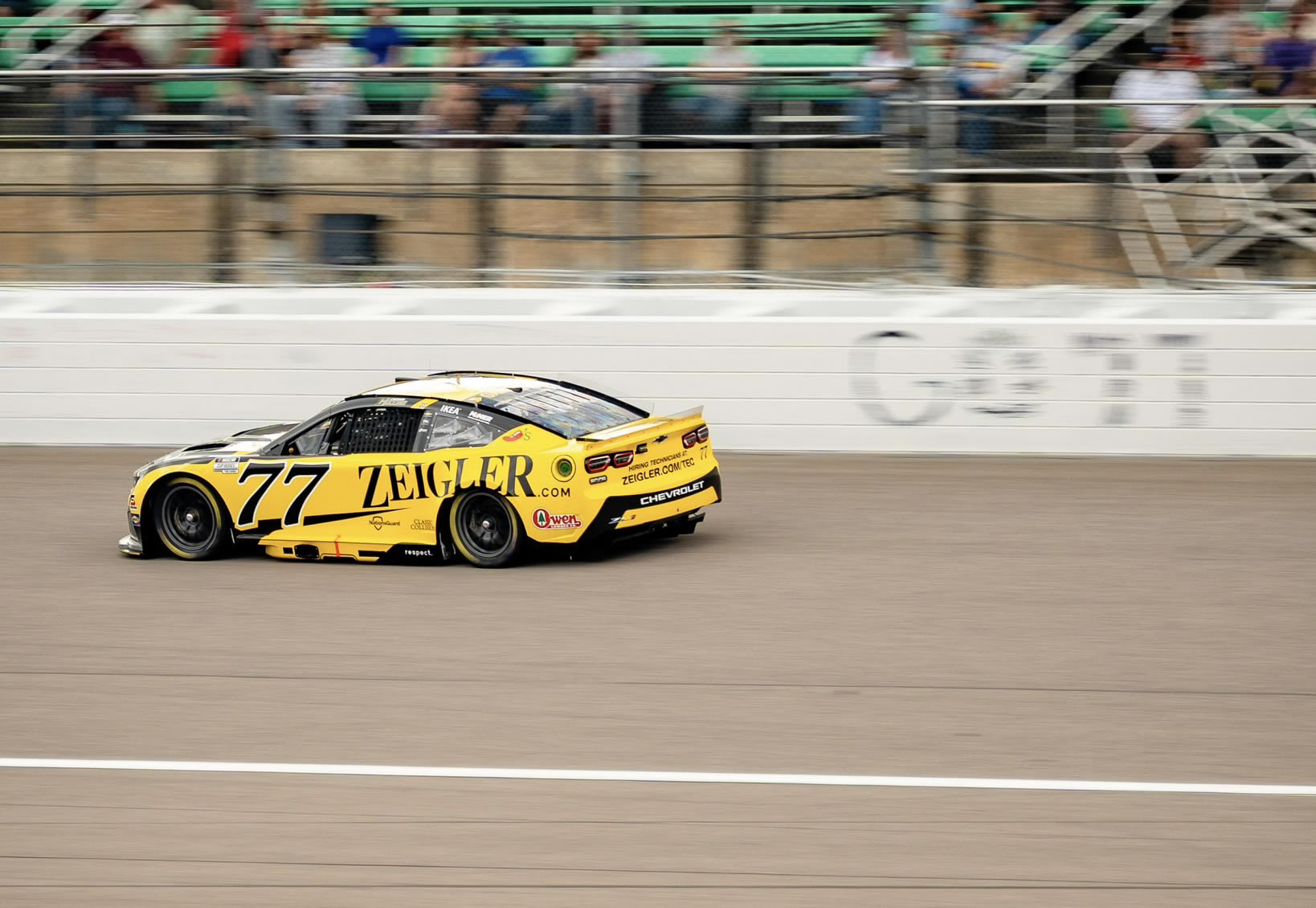 KANSAS CITY, KANSAS - SEPTEMBER 27: Carson Hocevar, driver of the #77 Zeigler Auto Group Chevrolet, drives during the NASCAR Cup Series Hollywood Casino 400 at Kansas Speedway on September 27, 2026 in Kansas City, Kansas. (Photo from Spire Motorsports)