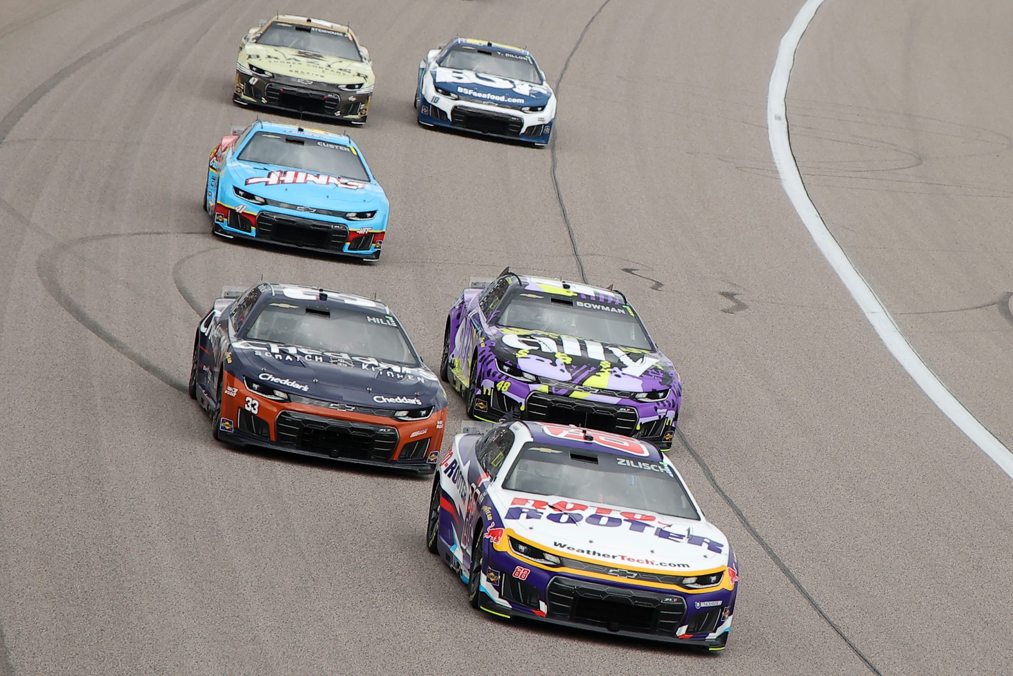 KANSAS CITY, KANSAS - SEPTEMBER 27: Connor Zilisch, driver of the #88 Roto-Rooter Chevrolet, Austin Hill, driver of the #33 Cheddar's Scratch Kitchen Chevrolet, Alex Bowman, driver of the #48 Ally Chevrolet, and Cole Custer, driver of the #41 Haas/Andy's Chevrolet, race during the NASCAR Cup Series Hollywood Casino 400 at Kansas Speedway on September 27, 2026 in Kansas City, Kansas. (Photo by Jonathan Bachman/Getty Images) | Getty Images
